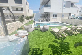 Family friendly apartments with a swimming pool Novalja, Pag - 23489